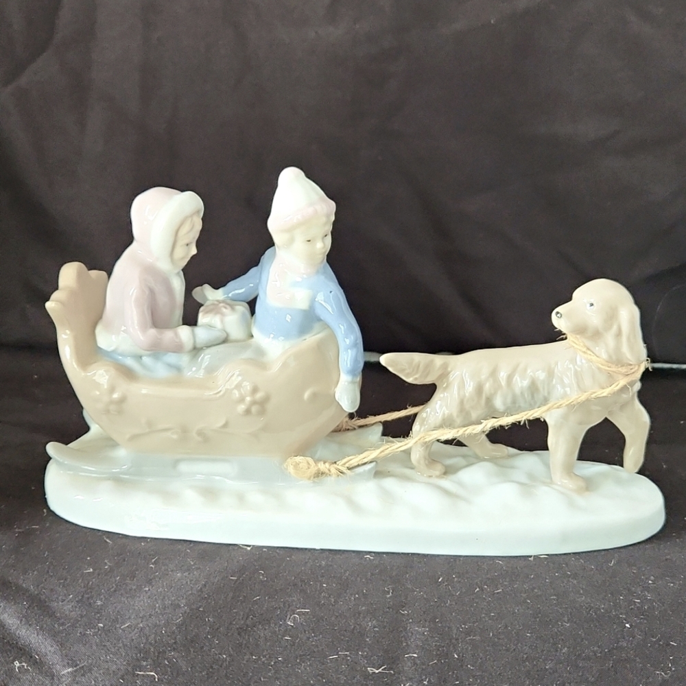 Paul Sebastian Dog Pulling Sled with Girl and boy.
